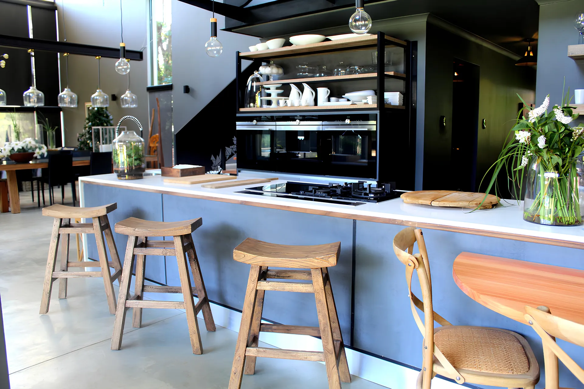 Industrial-style kitchen with open steel-framed shelving, fitted by N.D.I.